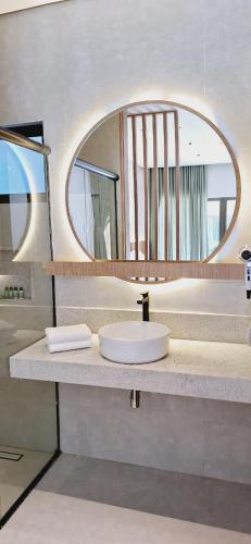 a bathroom with a sink and a mirror at Be Caju Hotel in Barra Grande