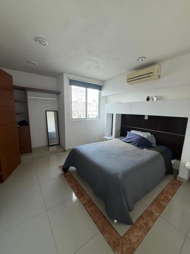 En eller flere senge i et værelse på Departamento Flor de Loto