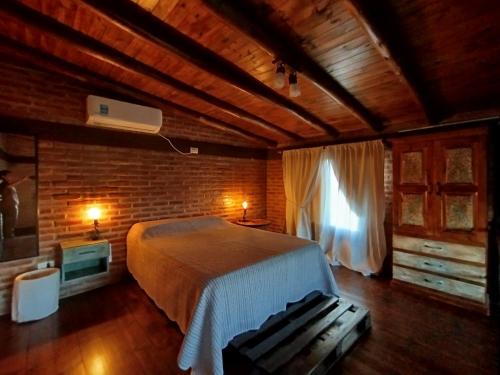 En eller flere senge i et værelse på Kuntur Casas de Campo