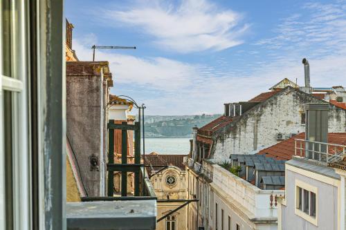 a view of a city from a balcony of buildings at Lisbon Core Apartments Bairro Alto in Lisbon
