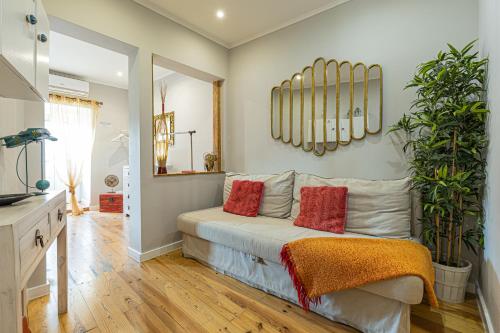 a bedroom with a bed with red pillows at Lisbon Core Apartments Bairro Alto in Lisbon