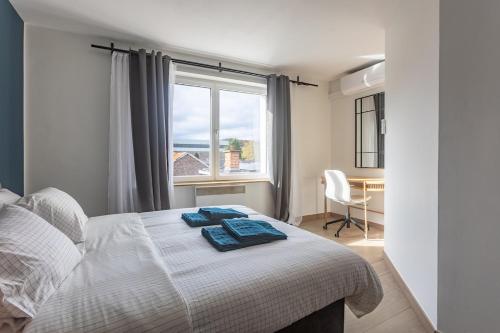 Ένα ή περισσότερα κρεβάτια σε δωμάτιο στο Moni 2D Residence