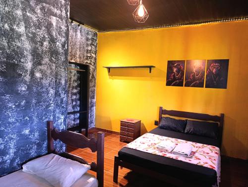 Postel nebo postele na pokoji v ubytování Pousada e camping Canastra Mineira