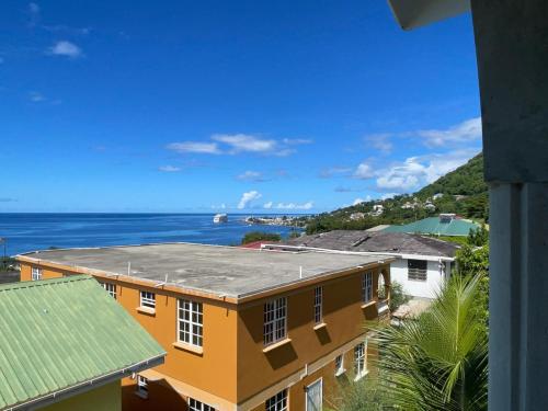 a view of the ocean from a building at Kingdom Rentals - AirBnCar in Roseau