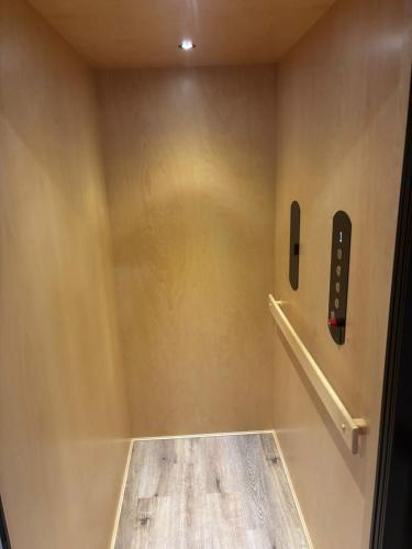 a corner of a room with a phone on a wall at 1st Luxury Residential Elevator rooftop deck in Rochester