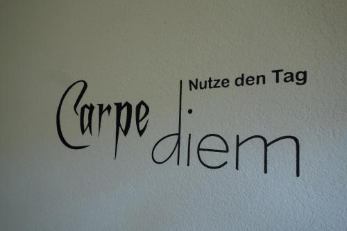 a sign on a wall that reads care eighteen at Anna in Benneckenstein
