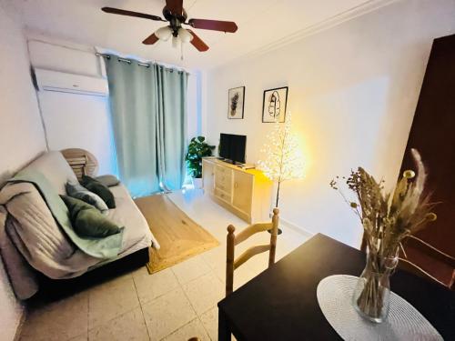 a living room with a couch and a table at Sun & Salt Lo Pagan in San Pedro del Pinatar