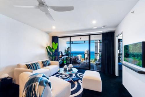 a living room with a couch and a table at Sea-view apartment in the heart of Gold Coast in Gold Coast
