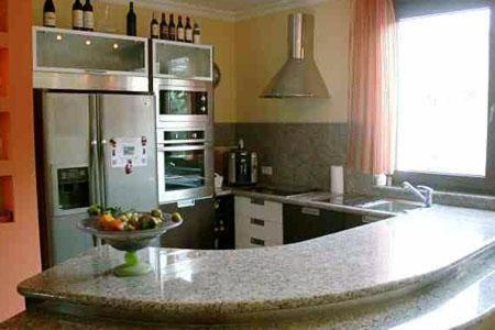 a kitchen with a bowl of fruit on a counter at Marbella Guia Isora in Guía de Isora