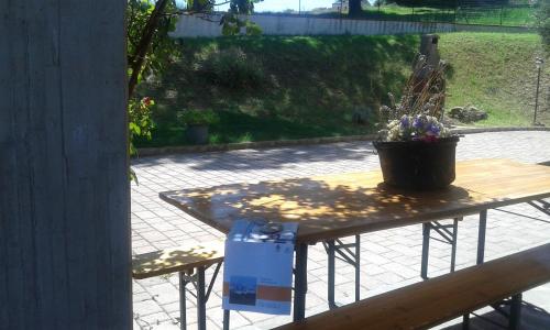 a table with a potted plant on top of it at Amor di Lavanda in Cingoli