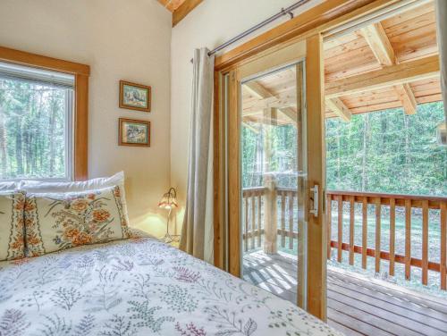 Ένα ή περισσότερα κρεβάτια σε δωμάτιο στο Riverwood Hideaway