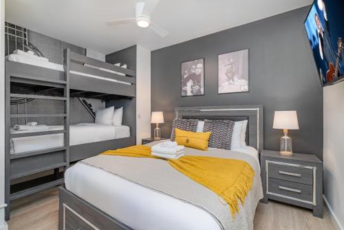 a bedroom with a bed and a bunk bed at Hyve - Neon Lights - Pool & Gym - Walk to Broadway in Nashville