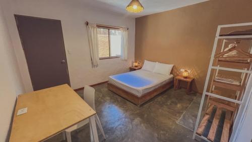 Ένα ή περισσότερα κρεβάτια σε δωμάτιο στο Kinti Coliving Mancora