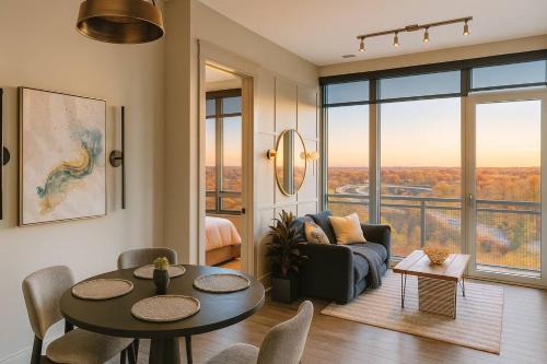 a living room with a table and a couch at Hala Tysons in McLean