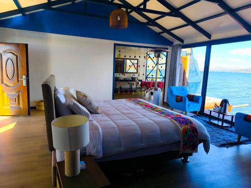 a bedroom with a large bed on a cruise ship at Uros Killa Lodge in Puno
