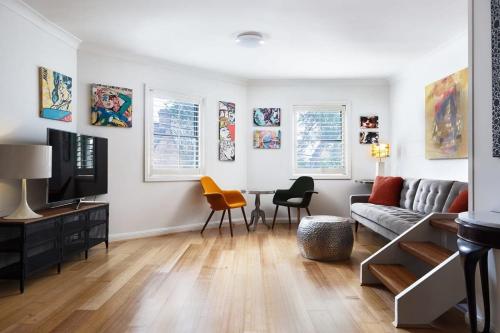 a living room with a couch and a table at Darlington Hideaway - Close to everything in Sydney