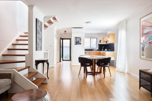 a living room and kitchen with a table and chairs at Darlington Hideaway - Close to everything in Sydney