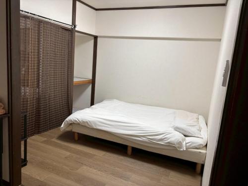 Postel nebo postele na pokoji v ubytování 板橋 RCアネックス Rc302
