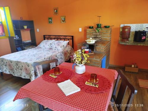 Ένα ή περισσότερα κρεβάτια σε δωμάτιο στο Chalé Catarina Mendes