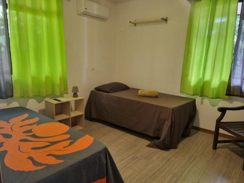 Ένα ή περισσότερα κρεβάτια σε δωμάτιο στο Fare Mape