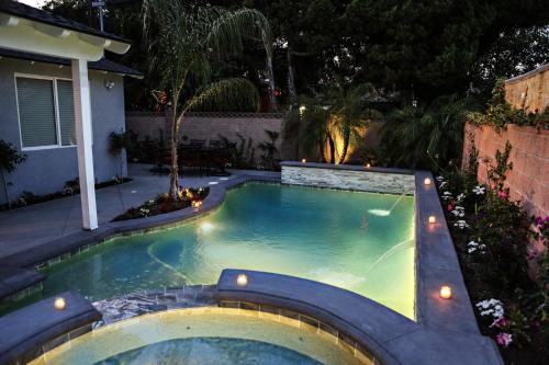 a small swimming pool in a backyard at night at Destination #35 in Anaheim
