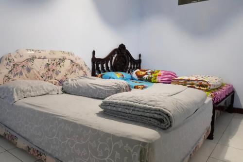 Postel nebo postele na pokoji v ubytování Villa MATAHARI BANDUNGAN