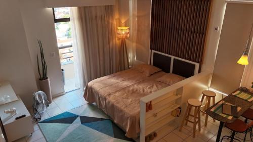 Cama o camas de una habitación en Studio Caxambu MG