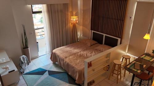 Cama o camas de una habitación en Studio Caxambu MG