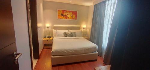 En eller flere senge i et værelse på Best Western Darbar