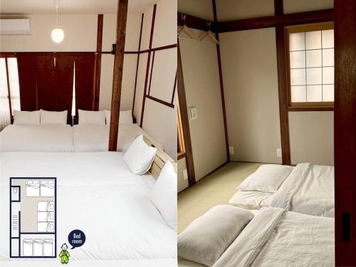 zwei Betten in einem Zimmer mit weißen Laken in der Unterkunft 亀のや in Tokio