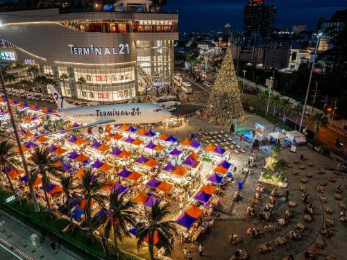 an overhead view of a christmas market with a christmas tree at Pineapple Residence Pattaya in Pattaya