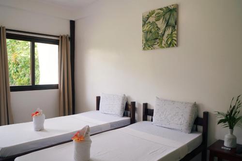 Postel nebo postele na pokoji v ubytování Point 303 Resort