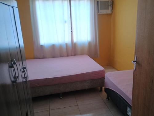 En eller flere senge i et værelse på Casa Praia dos Ingles