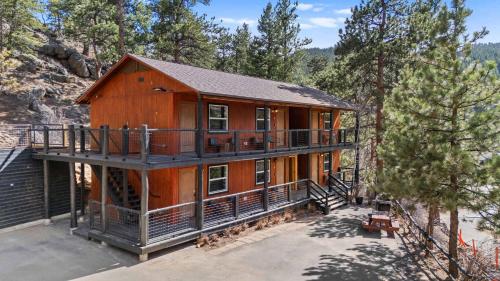 an aerial view of a large wooden house at Cabin 14 - King Bed hotel-style unit in Estes Park