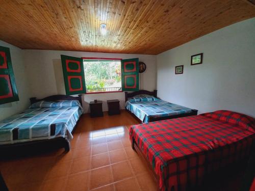 Postel nebo postele na pokoji v ubytování Villa Alejandra