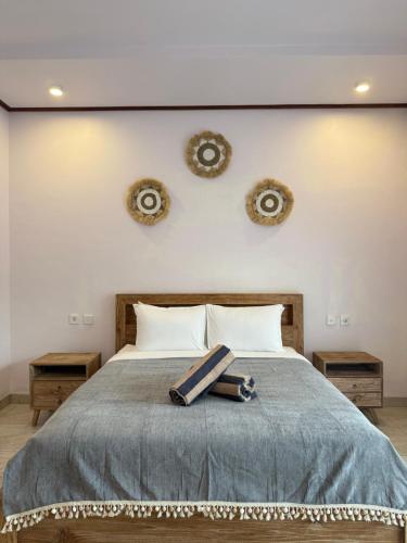 En eller flere senge i et værelse på Willy Apartement