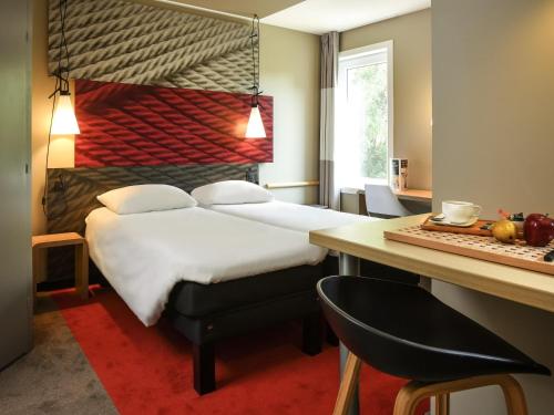 Ένα ή περισσότερα κρεβάτια σε δωμάτιο στο Ibis Brussels Erasmus