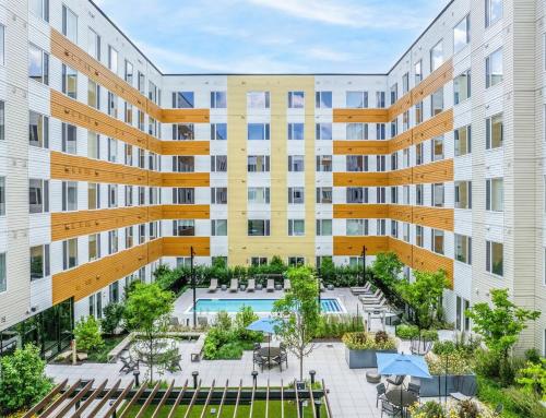 an apartment building with a courtyard with a swimming pool at Hyatus Luxury Residences Boston Everett Premier Collection in Everett