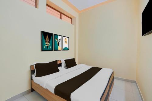 Ένα ή περισσότερα κρεβάτια σε δωμάτιο στο Hotel O Kukas Bus Terminal Formerly Stoneleaf Retreat