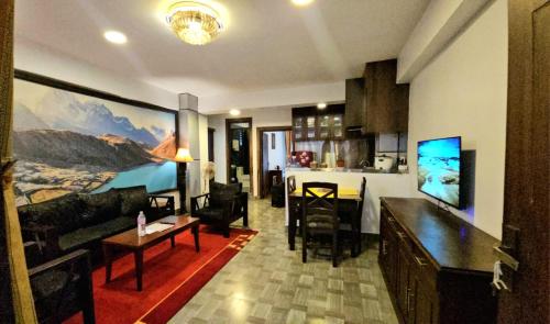 a living room with a kitchen and a living room and a living room at Sagarmatha Apartment Hotel in Pātan