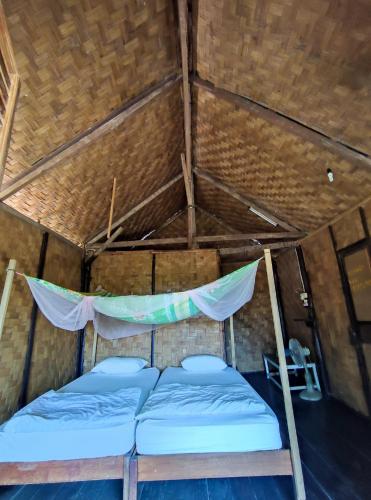 Ένα ή περισσότερα κρεβάτια σε δωμάτιο στο Veranda guesthouse and Bungalows