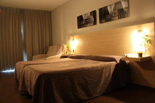 En eller flere senge i et værelse på Hotel Pontes do Eume