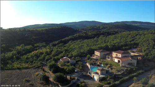 an aerial view of a house in the hills at Domaine de Flo ADULT a partir de 16 ans in Saint-Jean-de-la-Blaquière