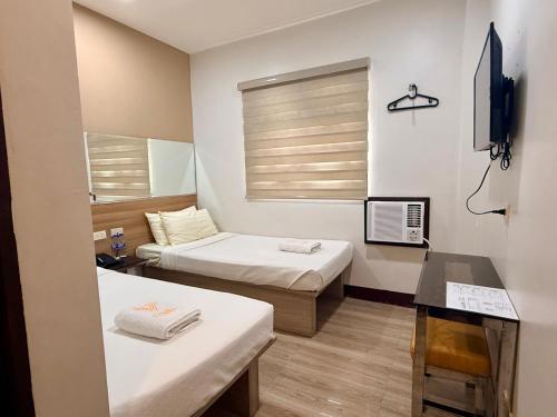 Postel nebo postele na pokoji v ubytování Vigan Traversa Hotel