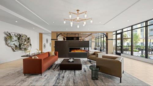 a living room with a couch and a fireplace at Hyatus Luxury Residences Boston Everett Marquis Collection in Everett