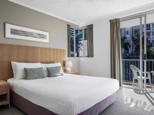 Ένα ή περισσότερα κρεβάτια σε δωμάτιο στο BreakFree Diamond Beach