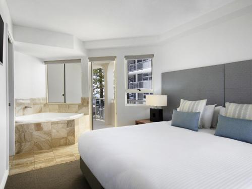 Ένα ή περισσότερα κρεβάτια σε δωμάτιο στο Mantra Zanzibar