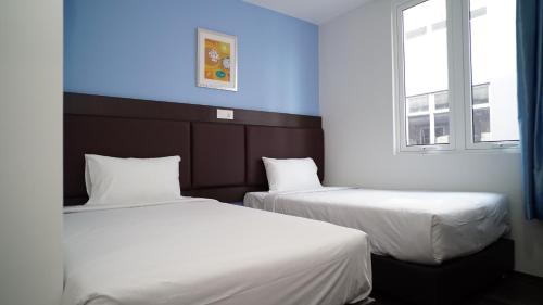 Postel nebo postele na pokoji v ubytování Hotel Cascada