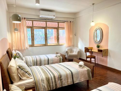 En eller flere senge i et værelse på Anne & Tan Stylist Homestay