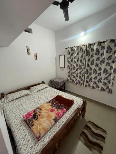 Ένα ή περισσότερα κρεβάτια σε δωμάτιο στο Coorg Mists Homestays